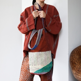 Kantha bucket bag with orange piad